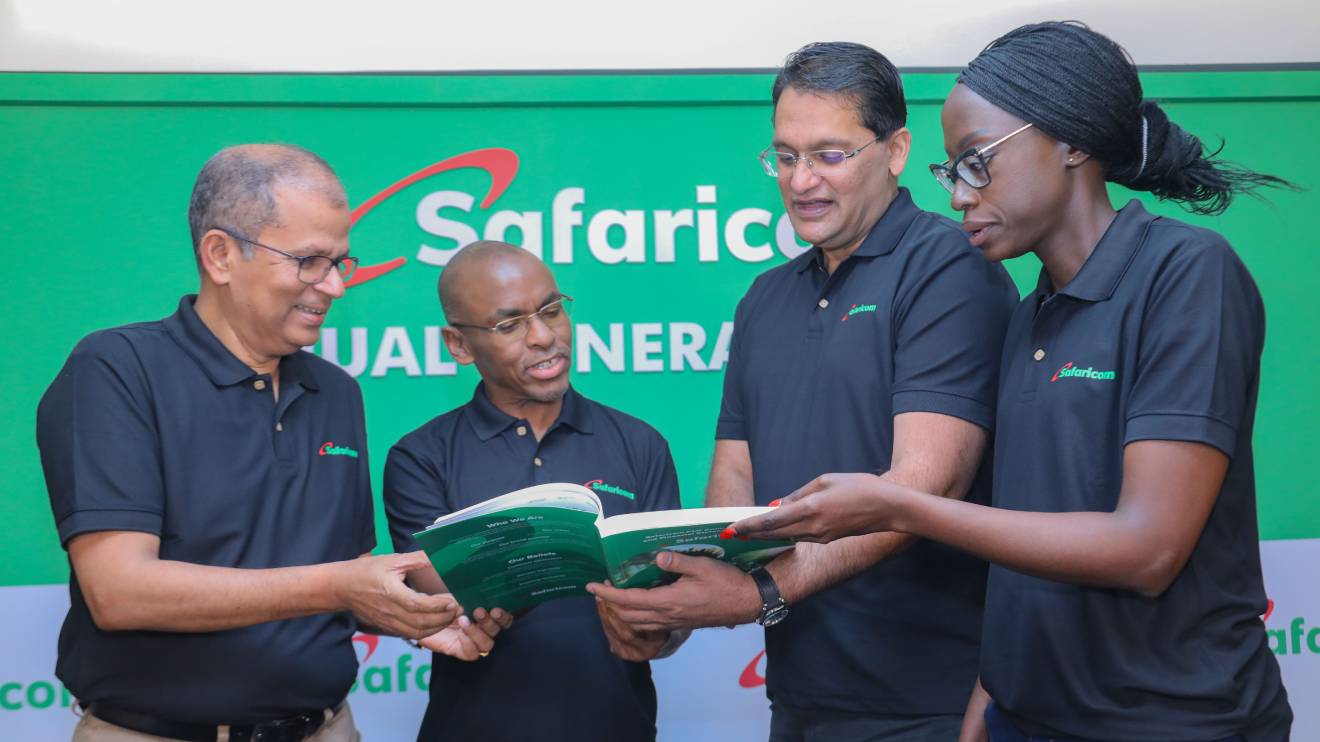 Safaricom PLC Chief Finance Officer Dilip Pal, CEO Peter Ndegwa, Chairman, Adil Arshed Khawaja and Ag Company Secretary Ms. Linda Mesa Wambani present the AGM report moments after the 16th Safaricom Annual General Meeting. PHOTO/COURTESY